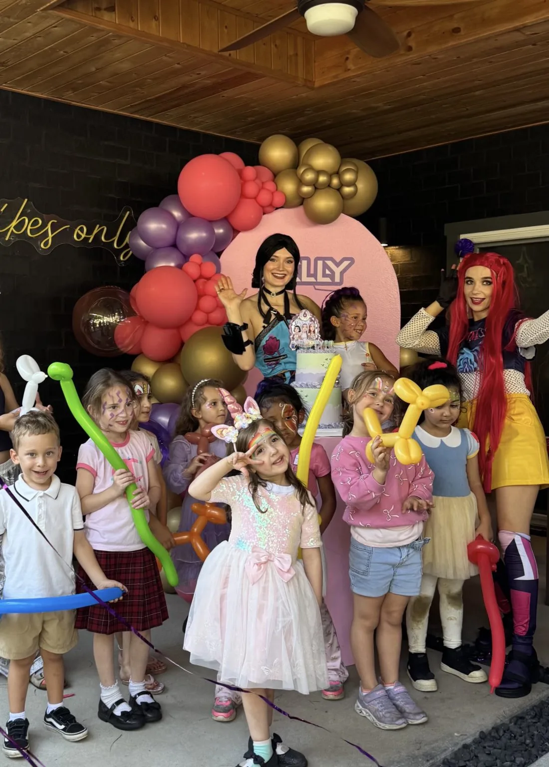 Children celebrating with party entertainers