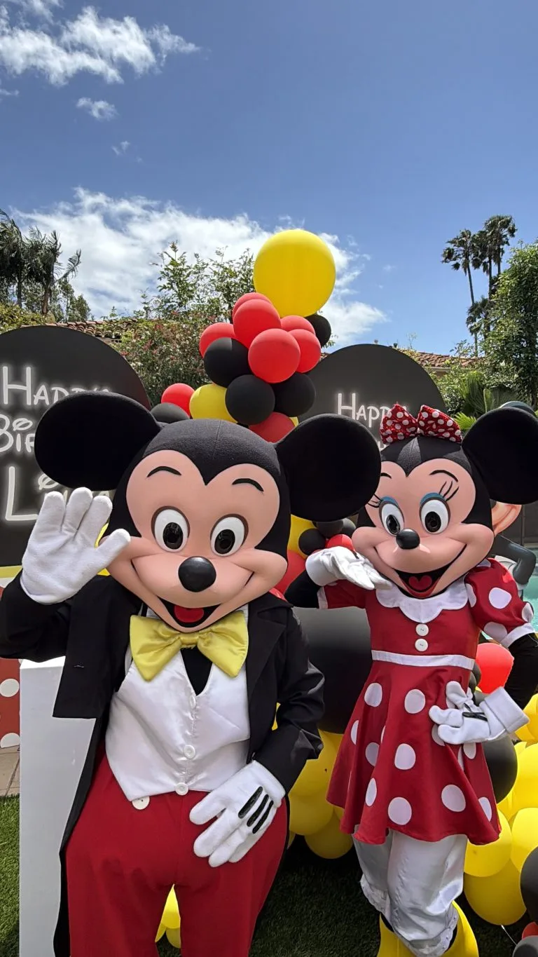 Mickey and Minnie mascots at a birthday party